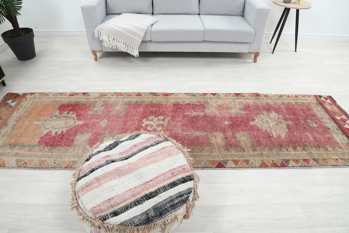 Full view of the rug laid out in a room, showing its scale and fit in a narrow space