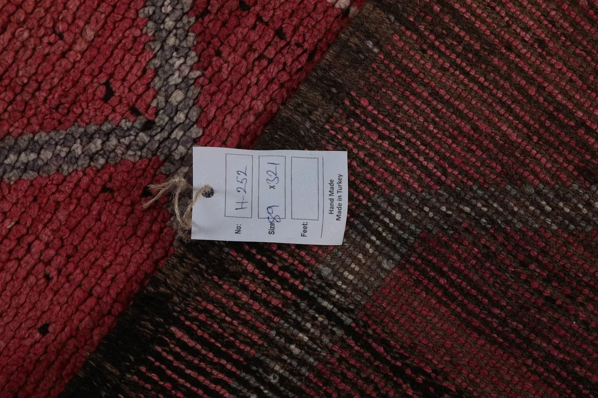 Rug tag showing dimensions 89 x 321 cm and 'Hand Made in Turkey' on the back of the rug