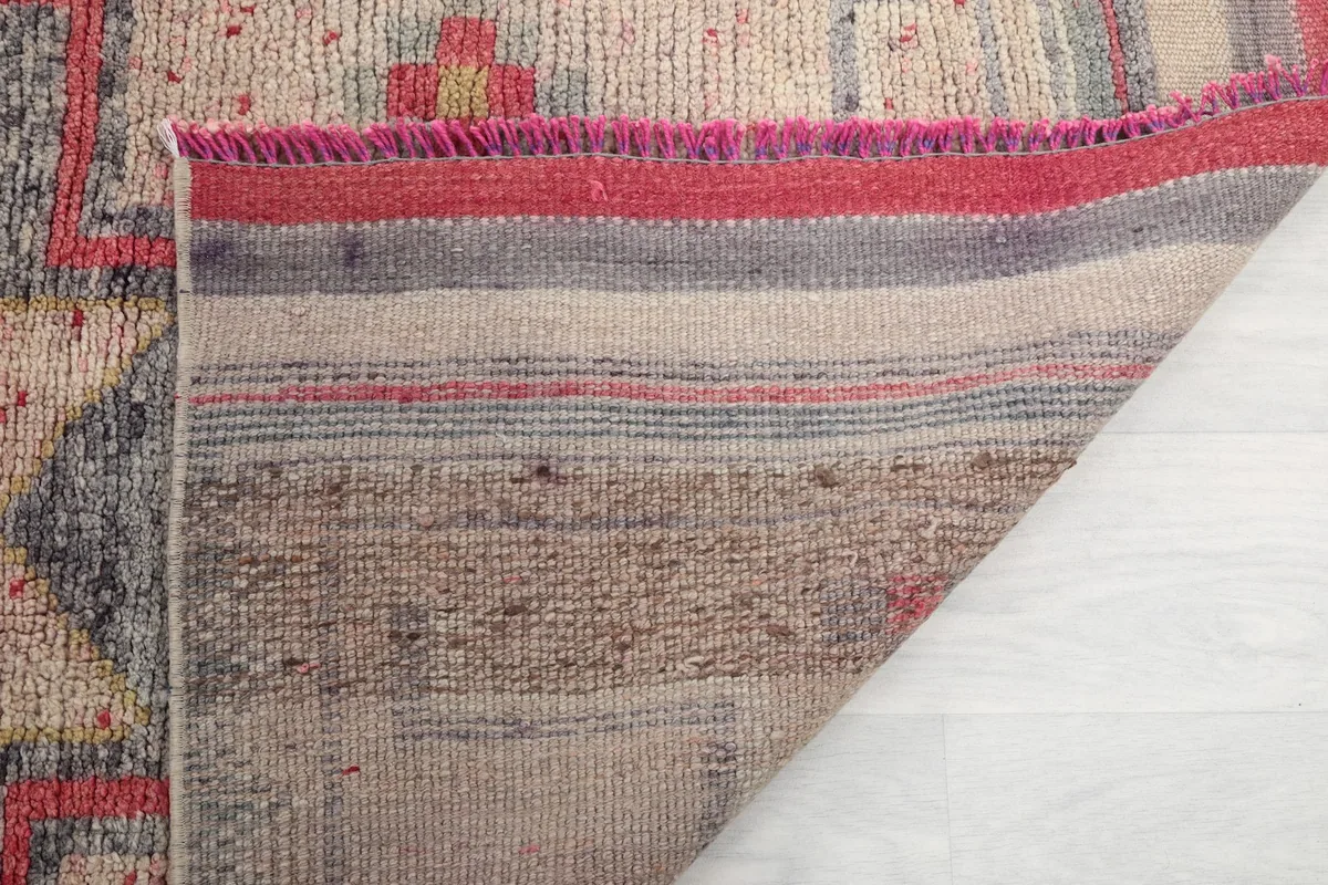 Detail of the back of the runner rug, revealing the woven cotton foundation and craftsmanship