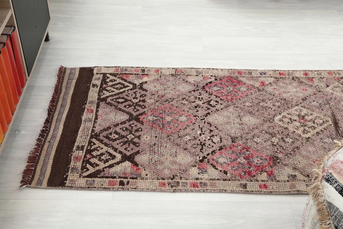 Angled view showing the rug's texture and color transitions along its length
