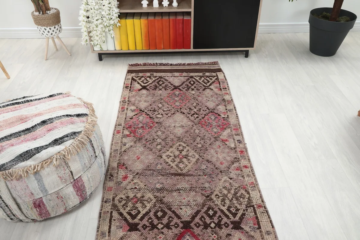 View of the runner rug from the opposite end in a room setting, showcasing its full design