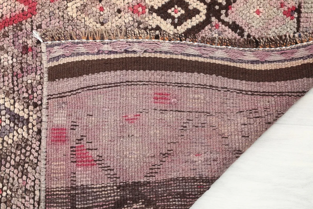 Close-up of the rug's backing, revealing the craftsmanship and material