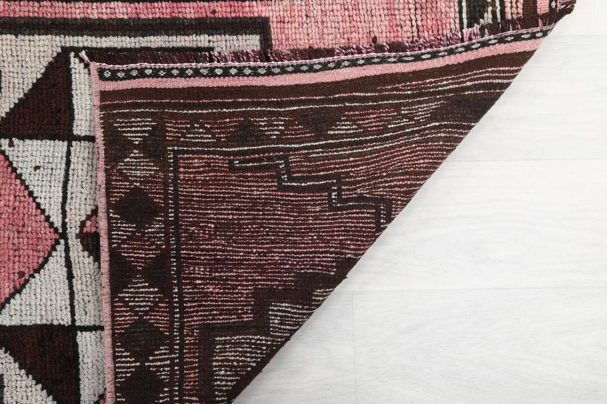 Another angle of the rug's reverse side, revealing the intricate hand-knotted structure