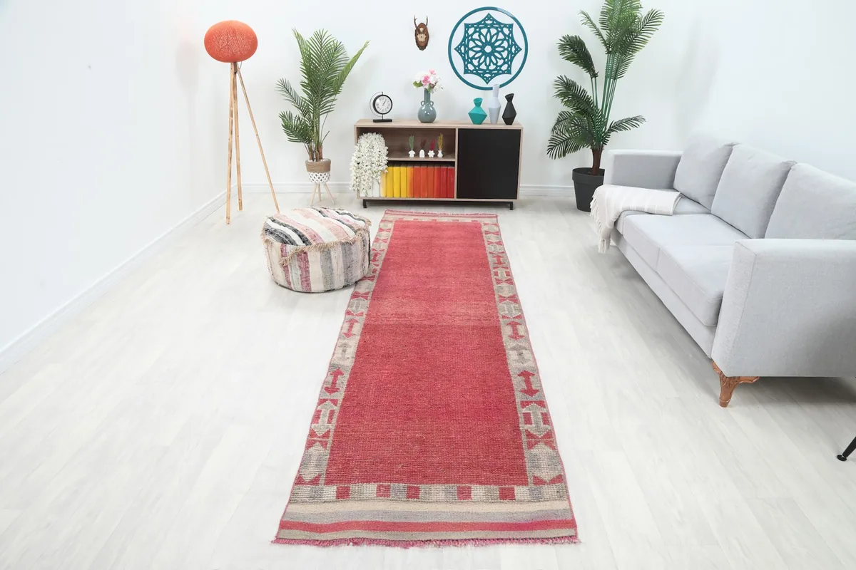 Runner rug in a modern living room setting, showing its length and how it complements light furniture.