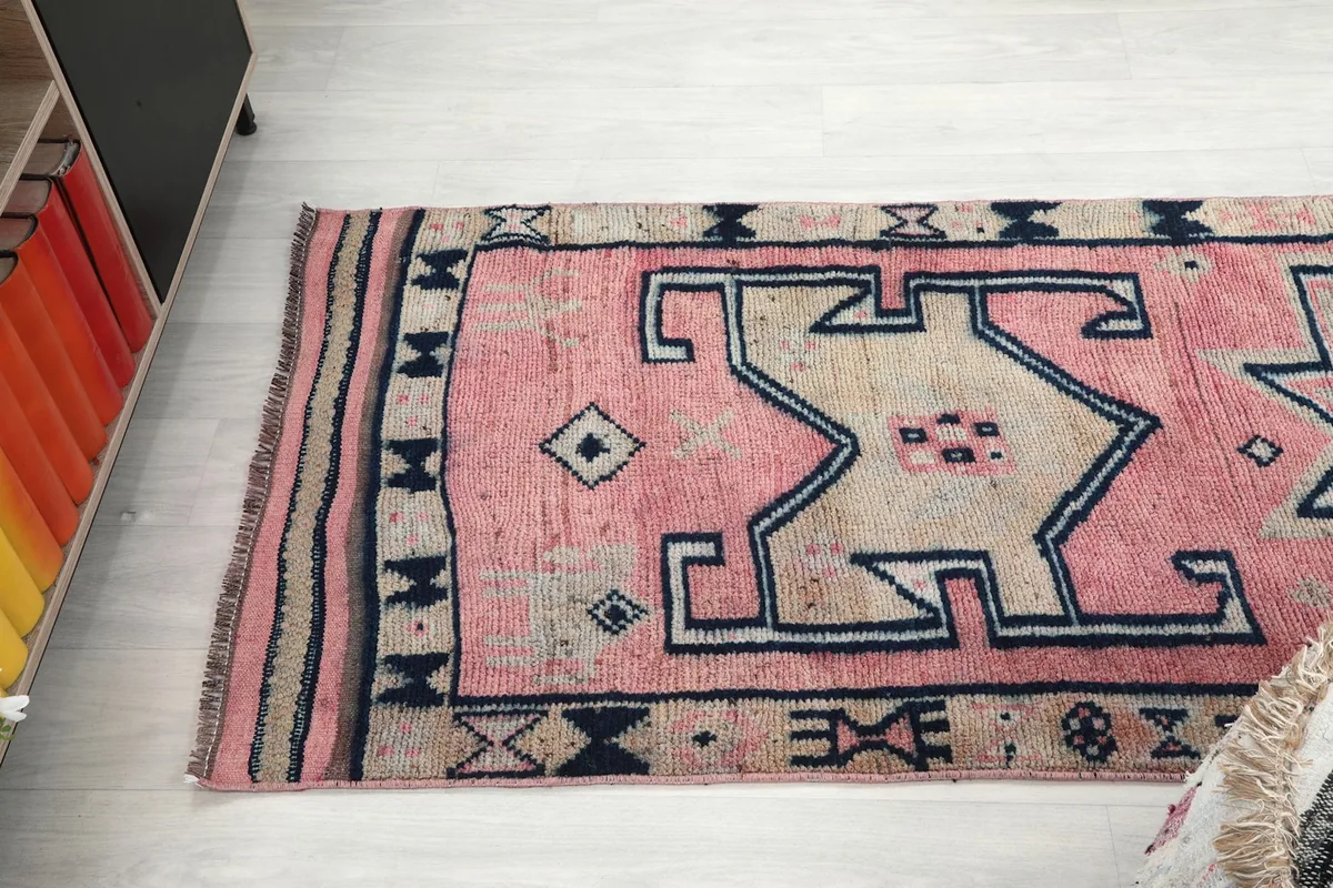 Angled view looking down the length of the runner rug, highlighting its full design