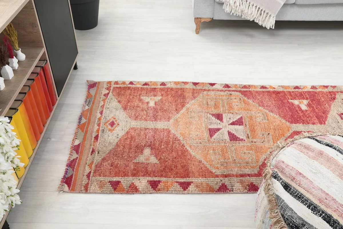 Angled view of the runner rug, showcasing its length and patterns in context