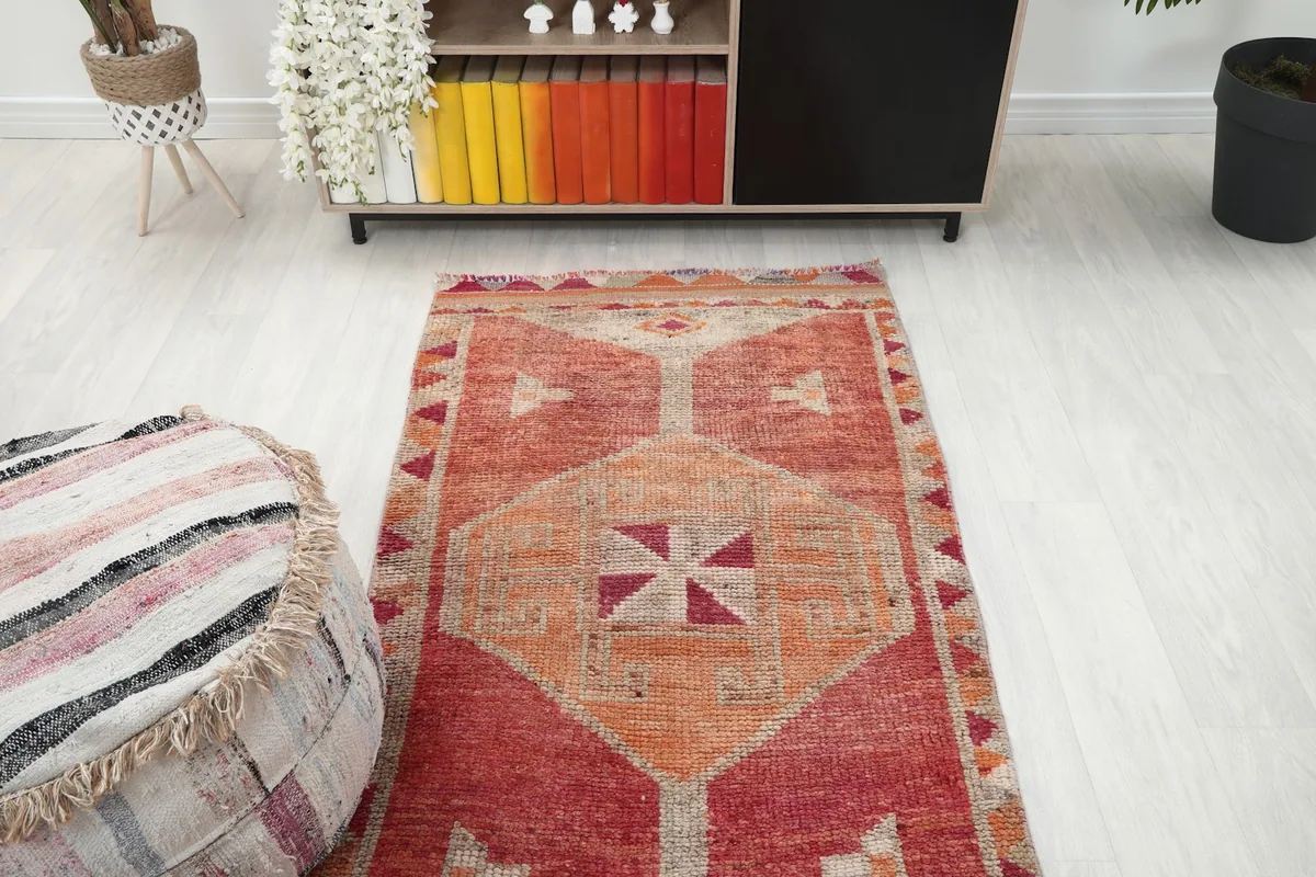 Overhead view showing the top section of the runner rug in a room