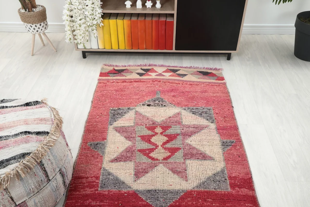 Overhead view of one end of the runner in a room, showcasing the border and main pattern