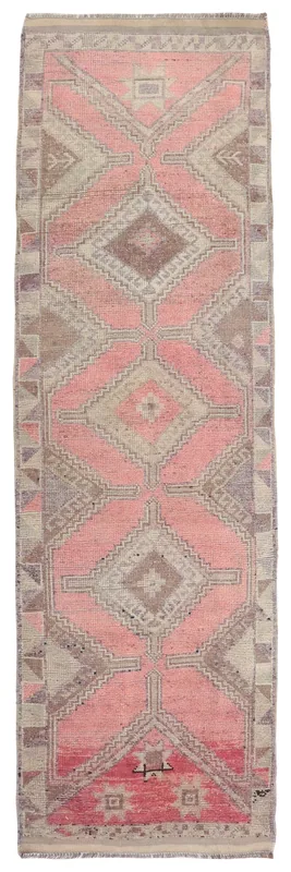 Full overhead view of the 3'0" x 10'8" rose and gray geometric vintage Anatolian runner rug on a white background.