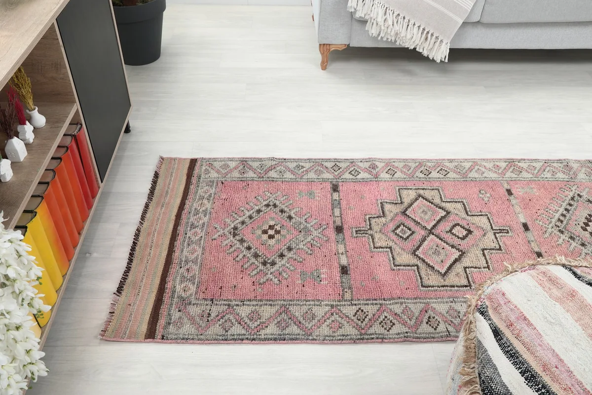 Runner rug extending through a hallway space, complementing the surrounding decor
