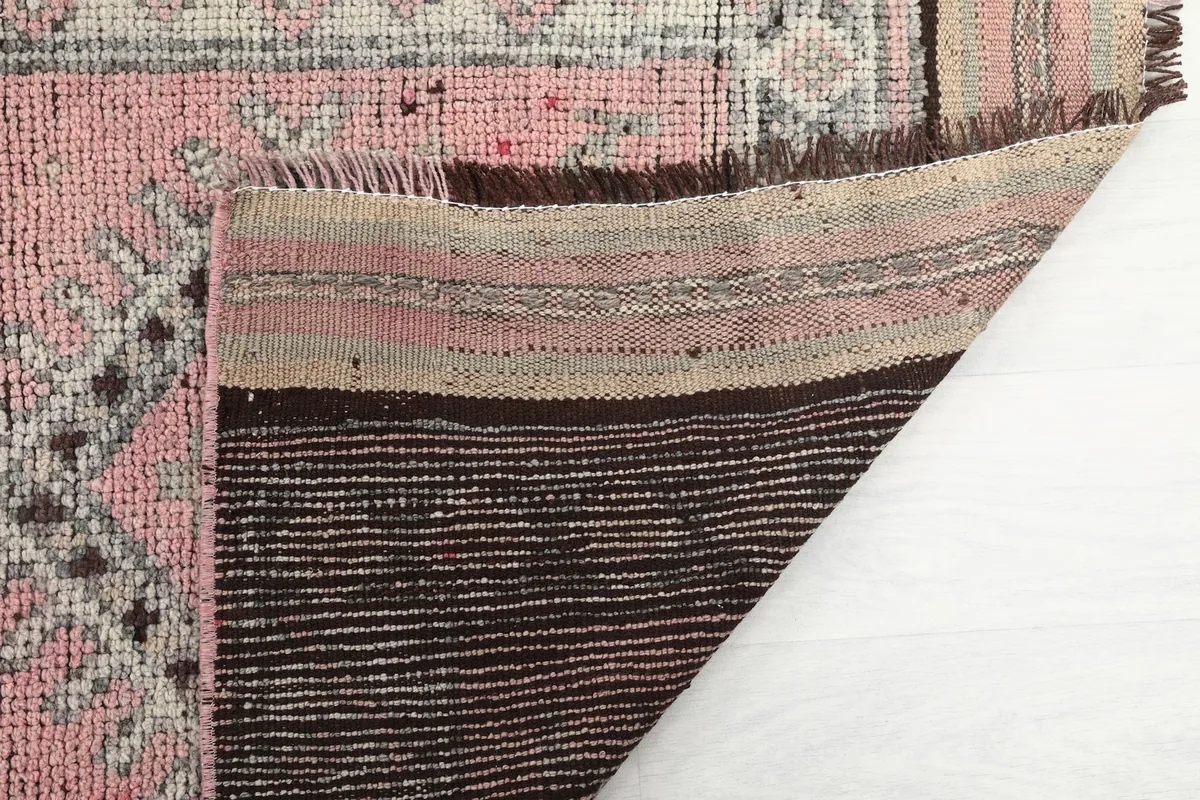 Close-up of the back of the rug, revealing the tight knotting and foundation details