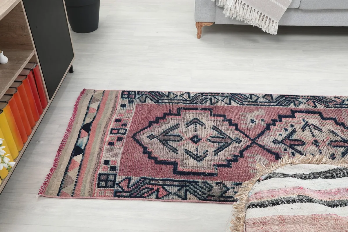 Side view of the runner rug extending into a living area, showing its scale