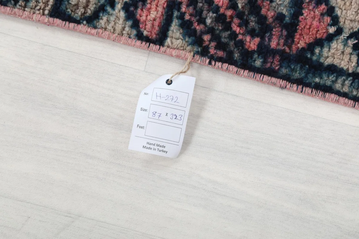 Product tag attached to the rug, showing size and origin details
