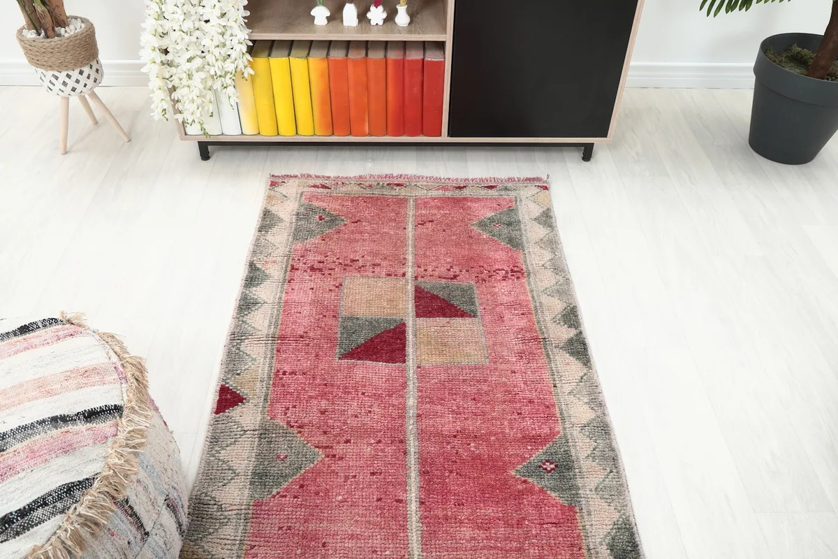 Overhead view of the runner rug in a room, showing its full design and surrounding decor.