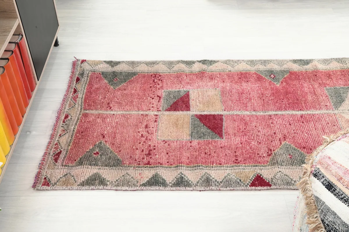 Top-down view of the runner rug in a room, emphasizing its length and pattern.