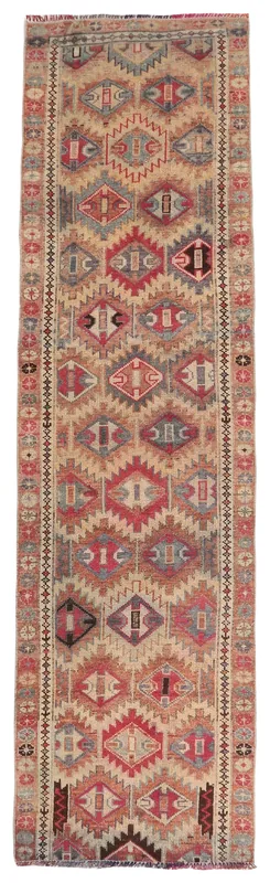 Full overhead view of the beige and red geometric runner on a white background