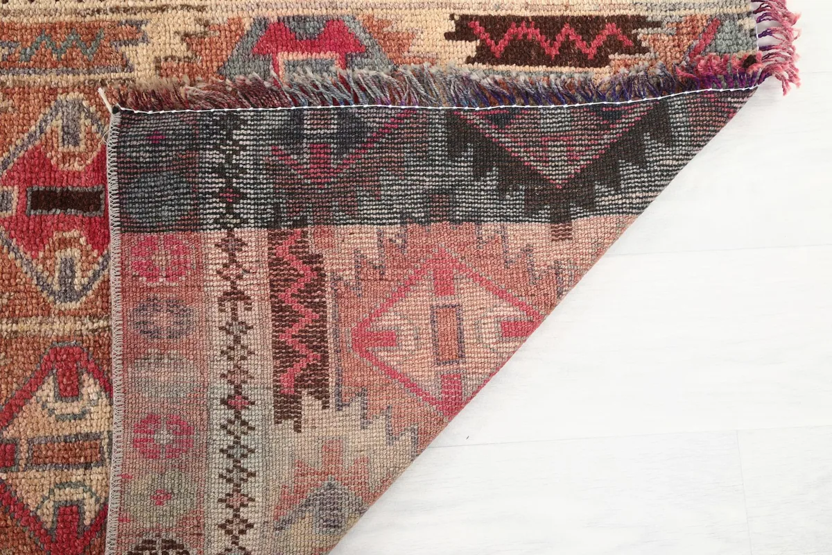 Close-up of the rug's back, showing the tightly woven knots and material