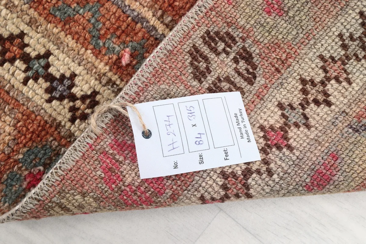Product tag attached to the rug, displaying its size and origin information