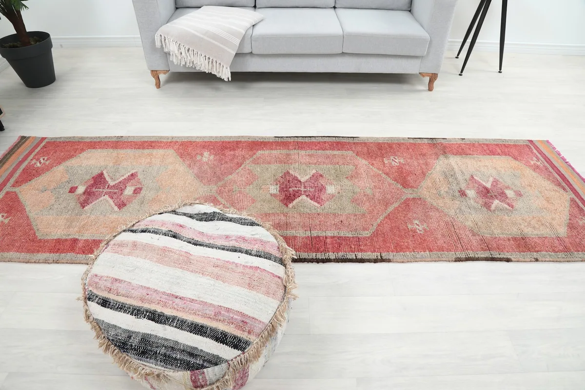 Wide shot of the runner rug in the room, showing its placement relative to furniture