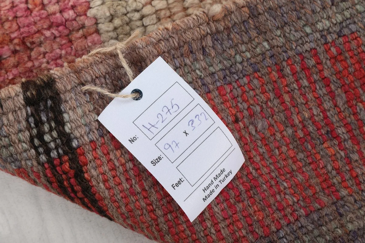 Rug label showing the item number, size in cm, and 'Hand Made in Turkey'