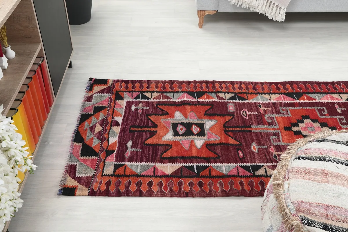 View of the runner rug stretching across the floor, from a slightly elevated perspective
