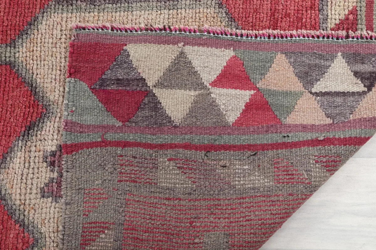 Close-up of the back of the rug, revealing the tight hand-knotting and foundation