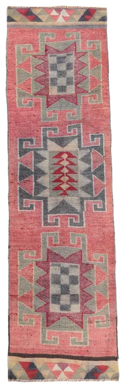 Full overhead view of the rose geometric Anatolian runner on a white background