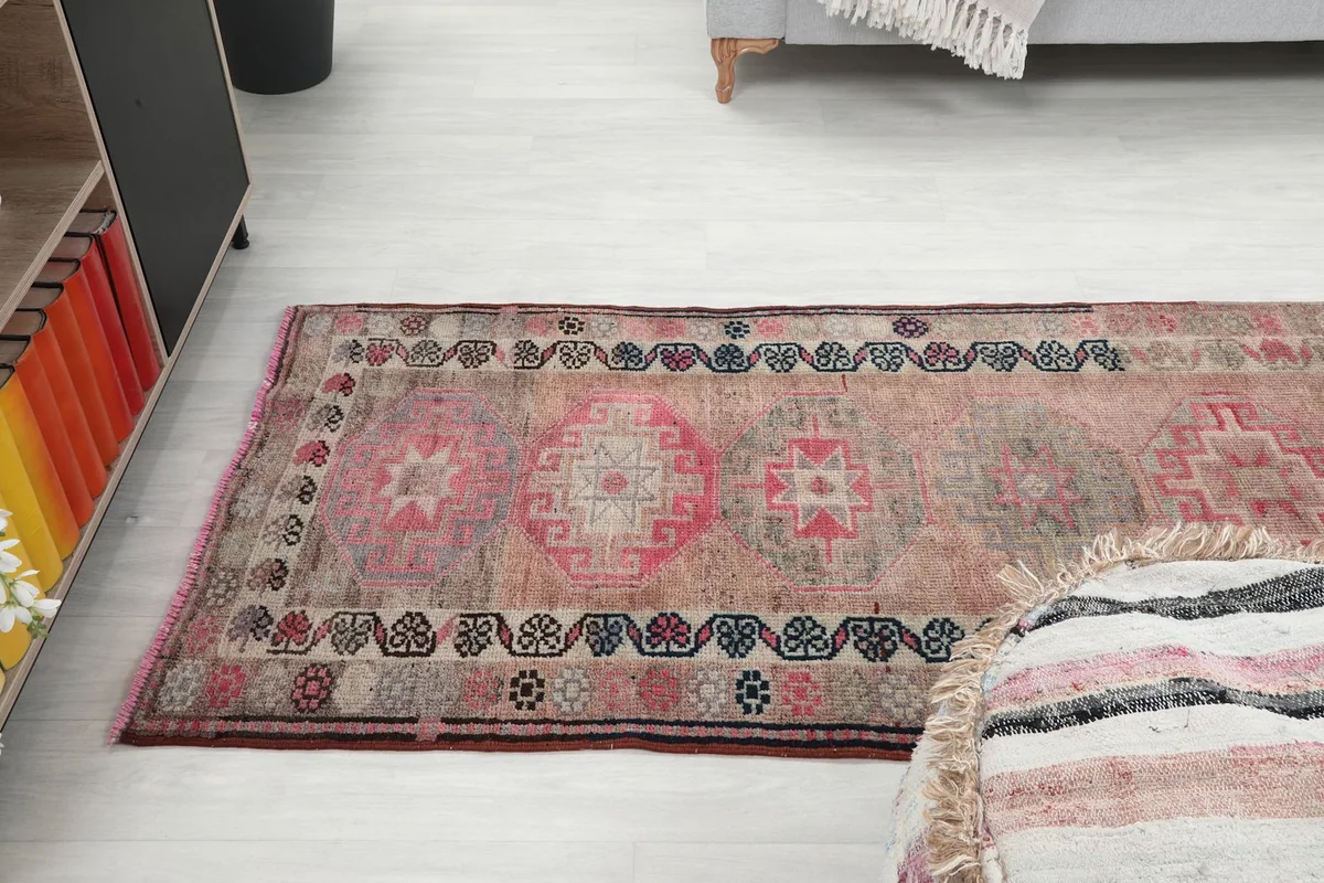 Angle view of the runner rug from above, showing its placement in a long hallway or living area.