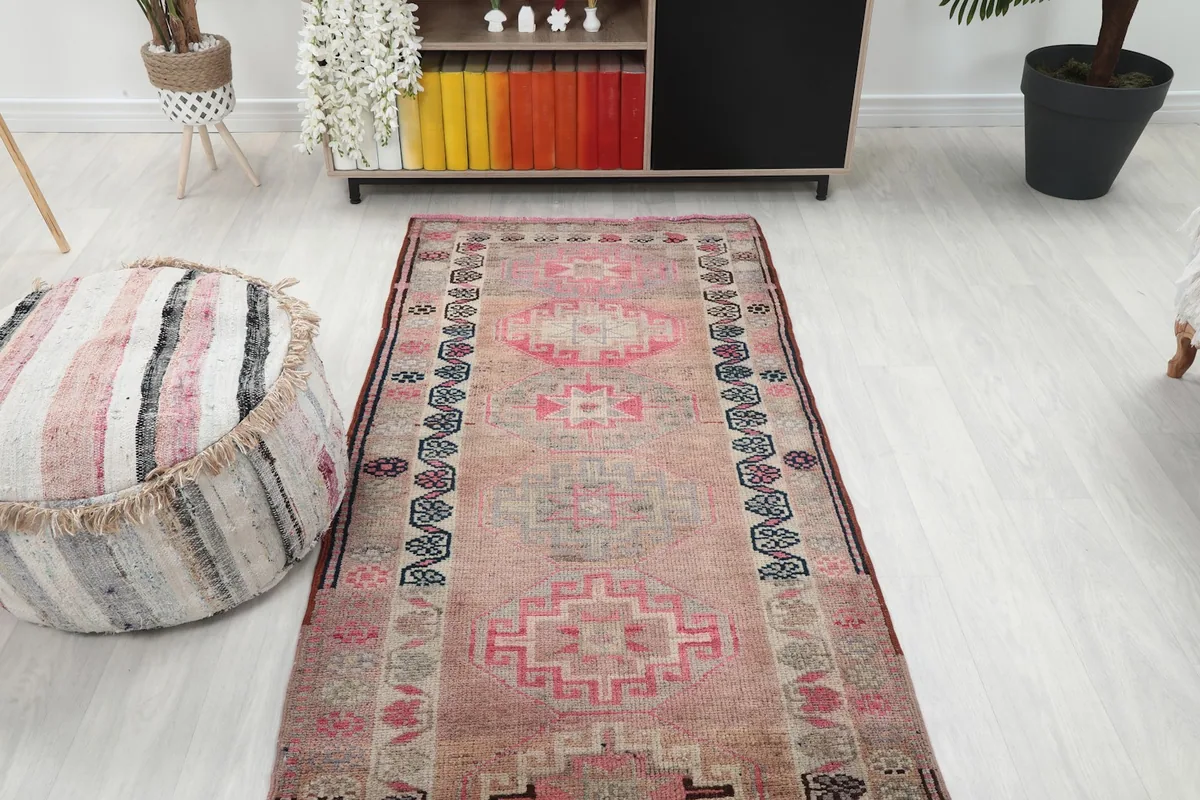 Overhead view of the runner rug in a room setting, emphasizing its length and overall pattern.
