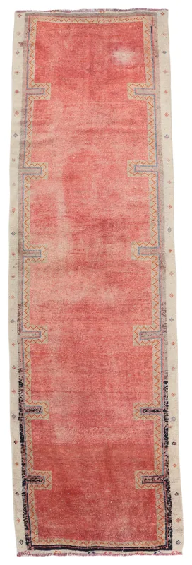 Full top view of the vintage rose and beige geometric Anatolian runner on a white background.