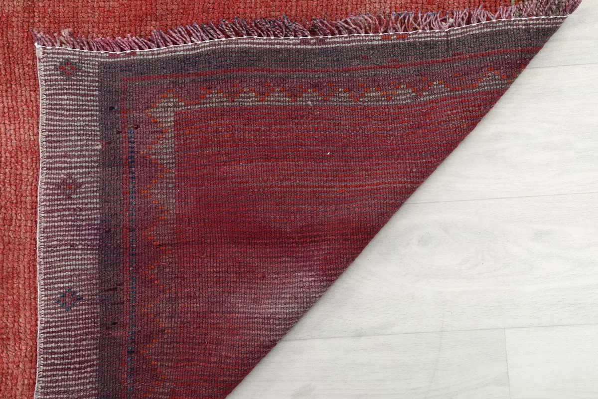 Close-up of the back of the rug, showing the intricate knotting and craftsmanship.