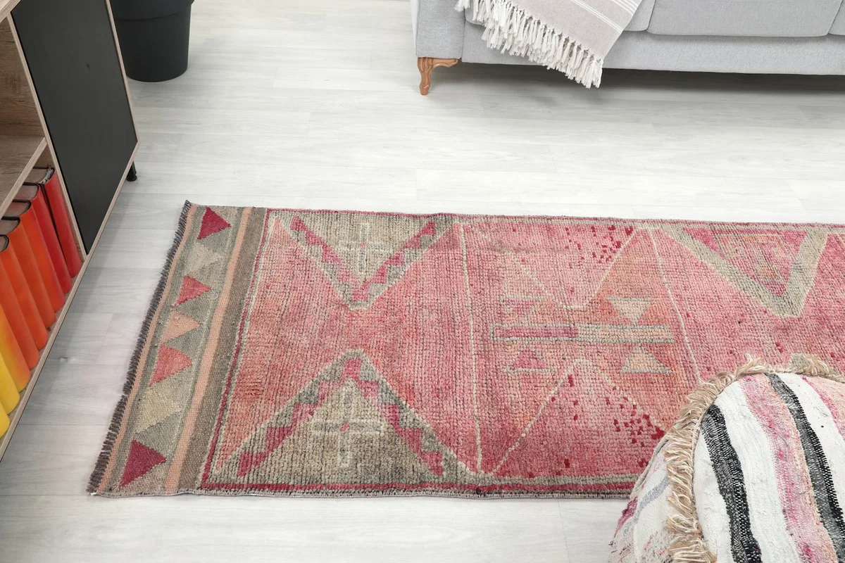 Angled shot of the runner rug from above, showing its placement in the room and the overall design
