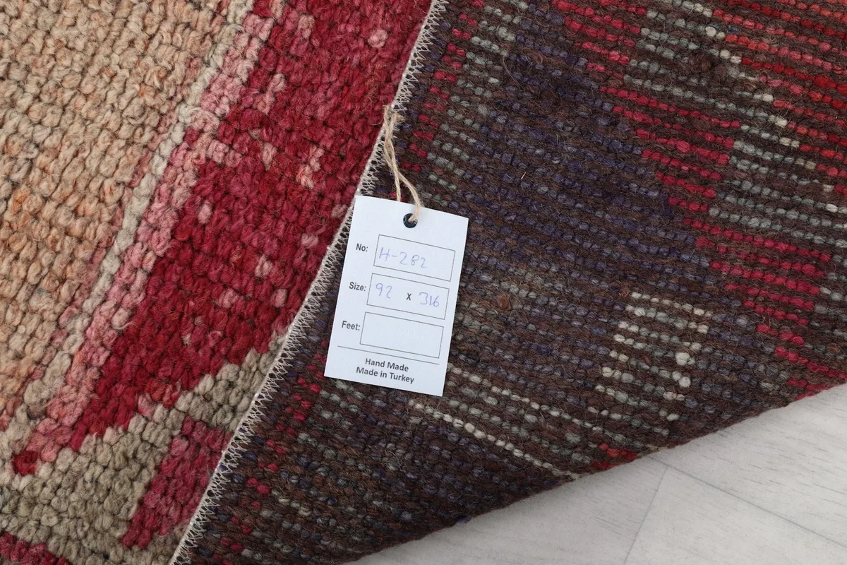 Detail of the rug's back with a product tag displaying size and origin information