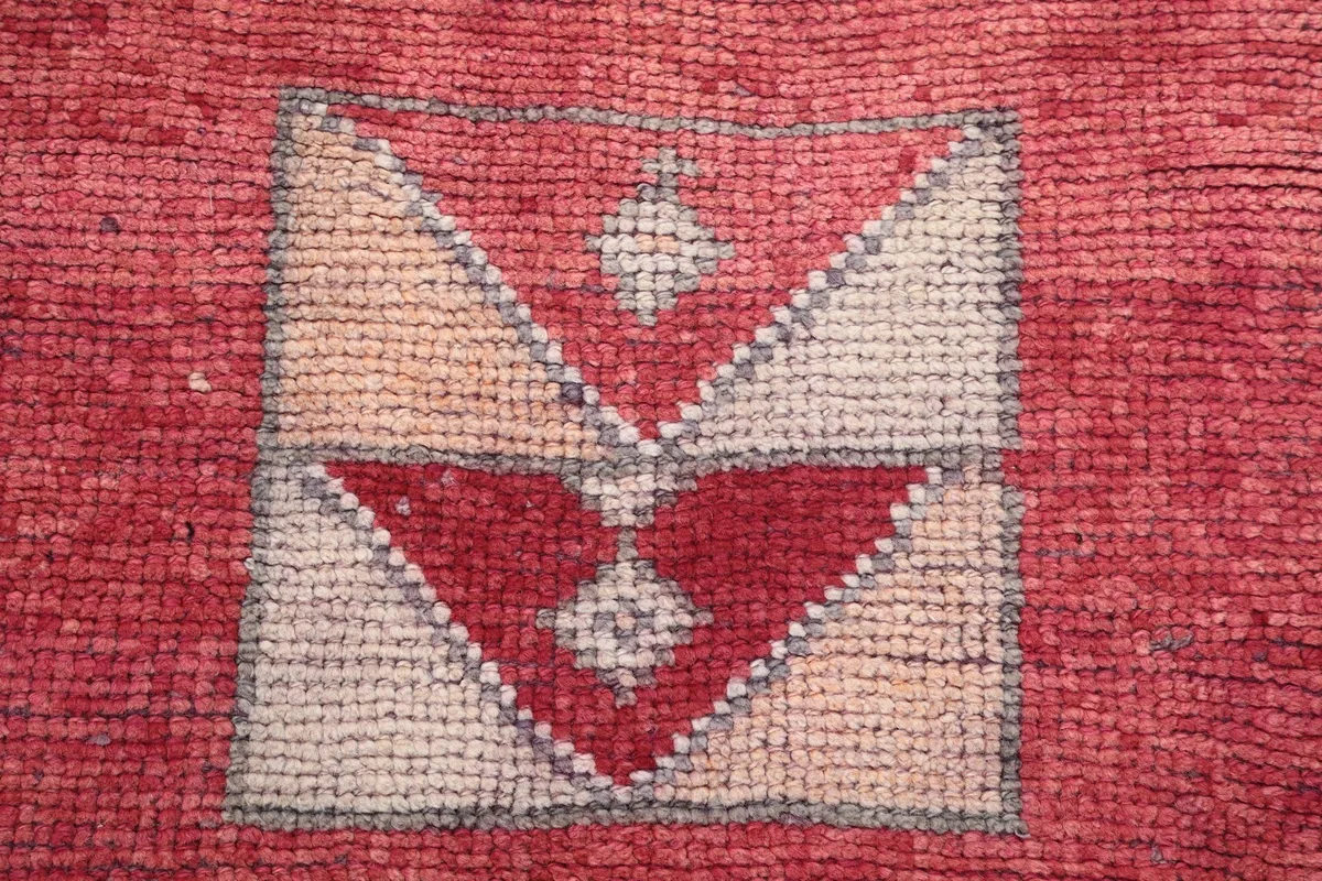 Macro view showing the hand-knotted wool pile texture and color variations