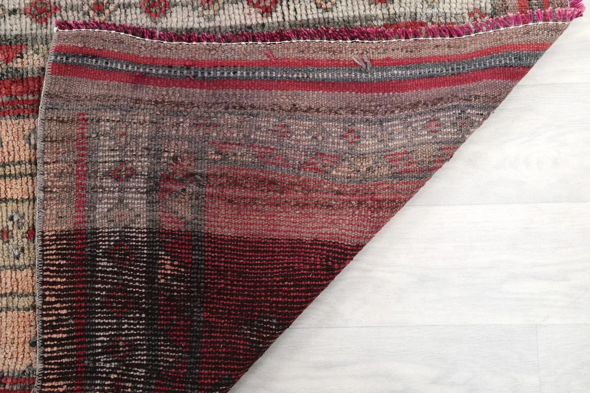 Underside view of the hand-knotted cotton foundation and reverse side of the wool pile