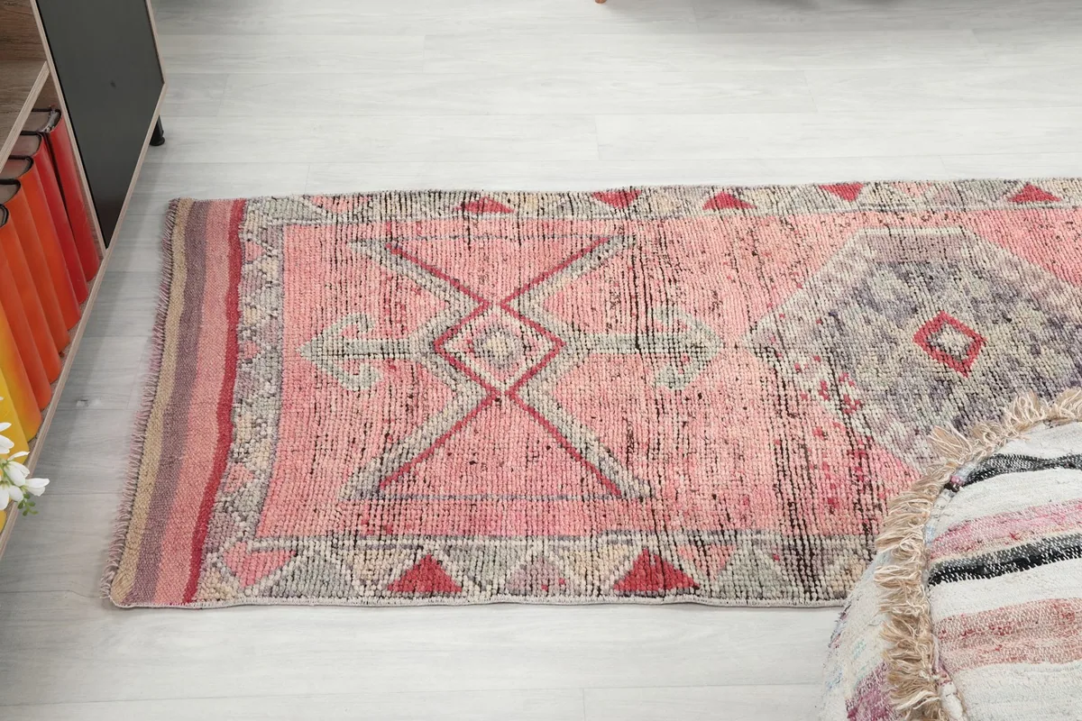 Angled top-down view of the runner rug, emphasizing its length and design in the room.