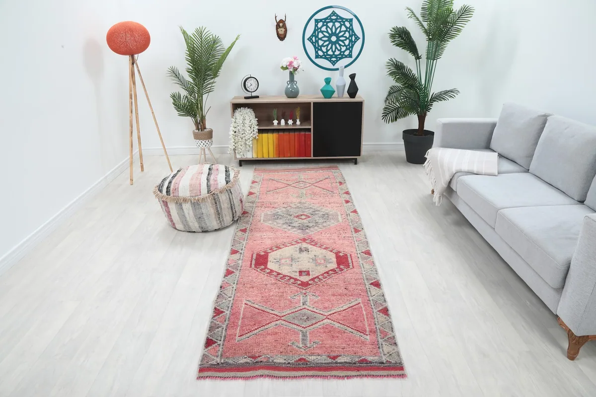 Runner rug displayed in a modern living room setting with light flooring and a gray sofa.
