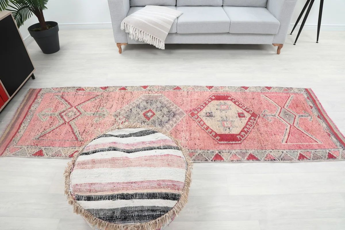 Full room view from above, showing the runner rug centered in the space with furniture.