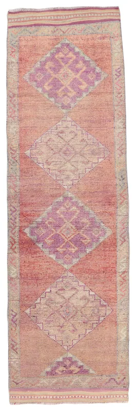 Full top view of the 3'1" x 11'1" vintage Anatolian runner rug with rose and purple geometric patterns