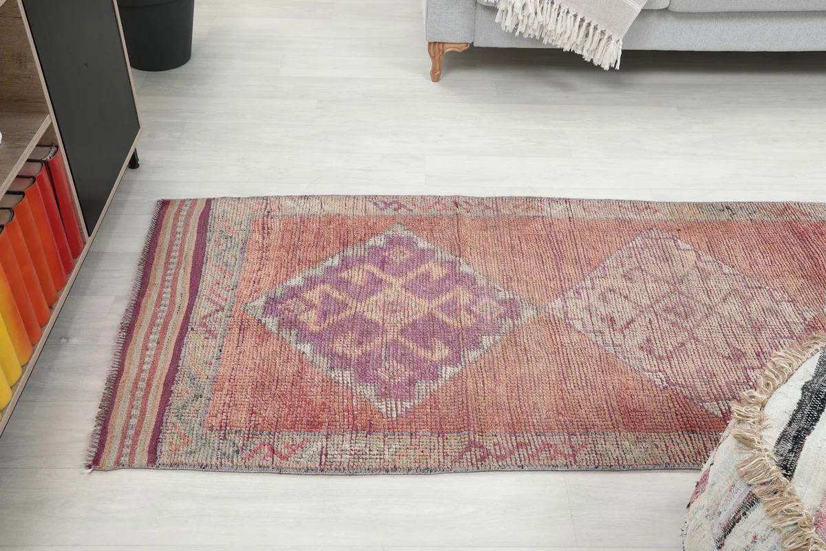 Angled view of the runner rug in a living space, showing its blend with modern decor elements