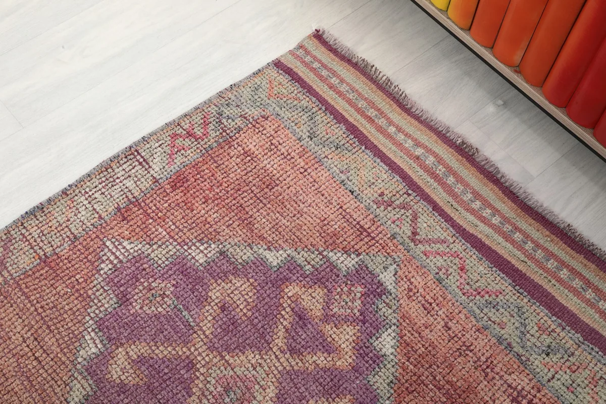 Close-up of the border design and fringed edge of the vintage Anatolian runner rug