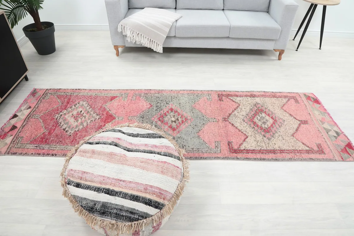 Full view of the runner rug in a room, emphasizing its scale next to furniture