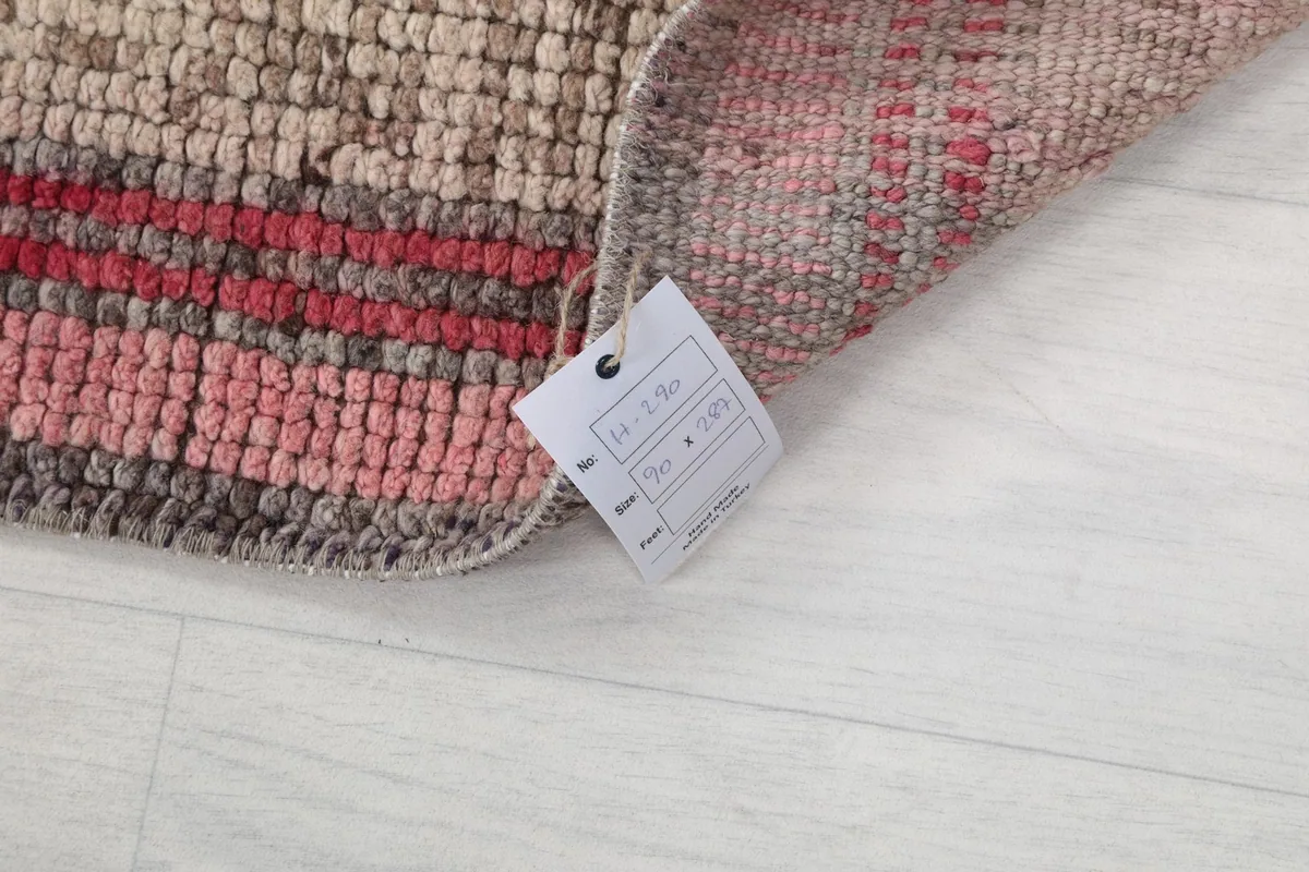 Corner of the rug with a product tag displaying its size and origin details