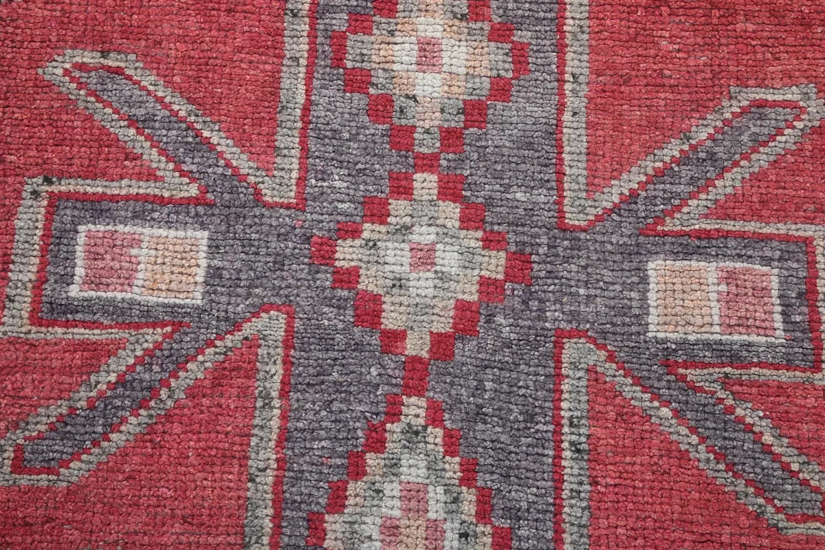 Macro detail of the hand-knotted wool pile, showing texture and color blending