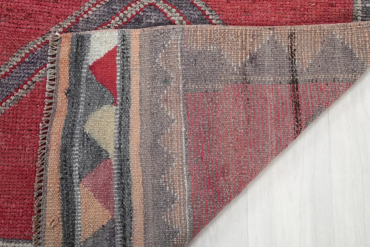 Close-up of the back of the runner, showing the hand-knotted cotton foundation