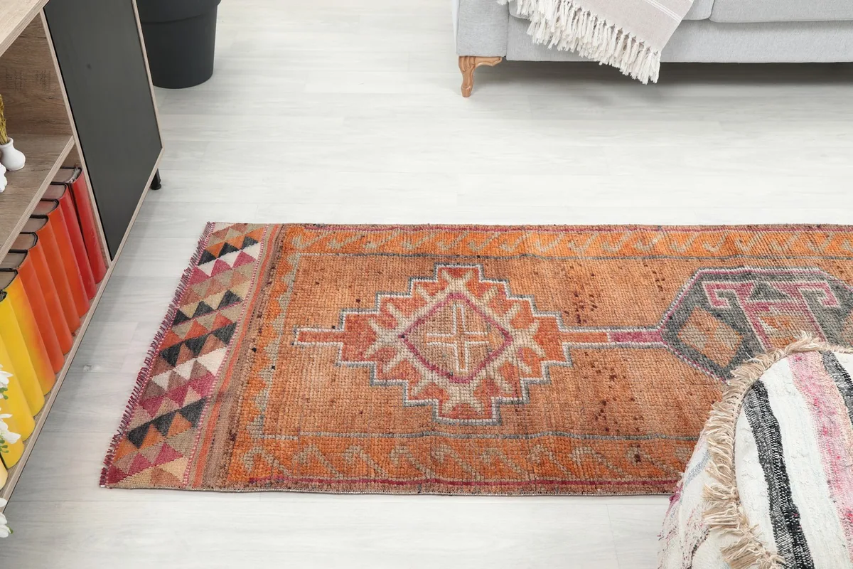 View of the runner rug stretching across a room, showing its proportion with furniture