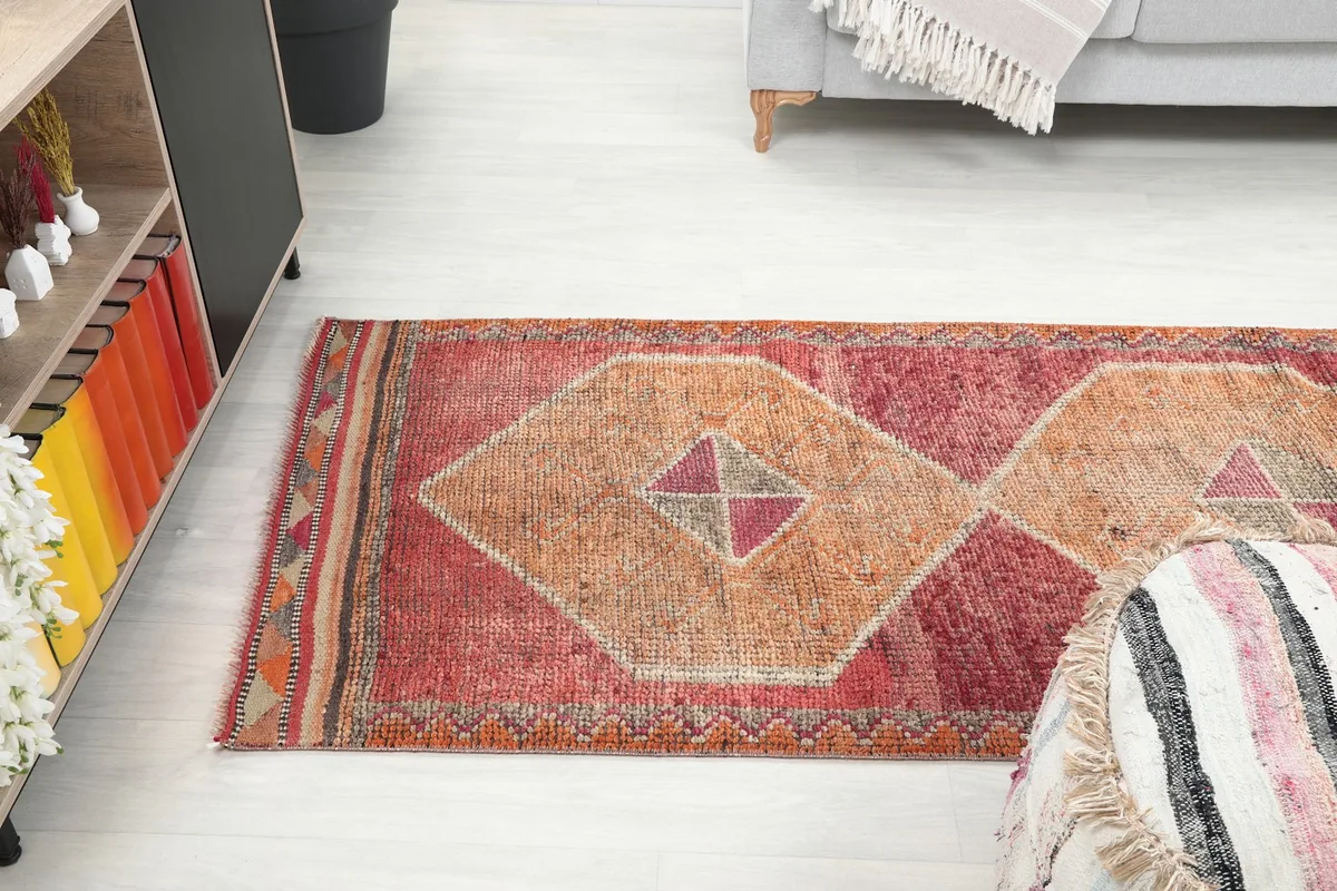 Angle shot of the runner rug in the room, showing part of the length