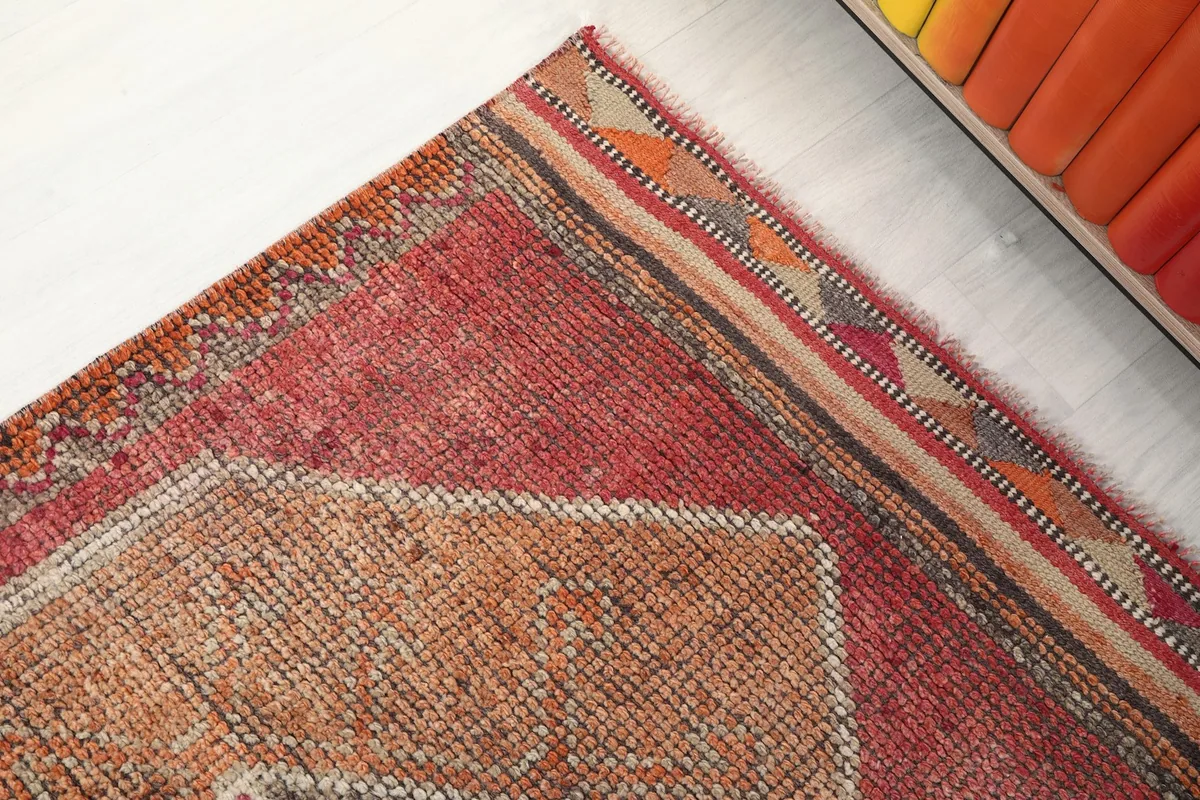 Detailed view of the patterned side border and end finish of the runner