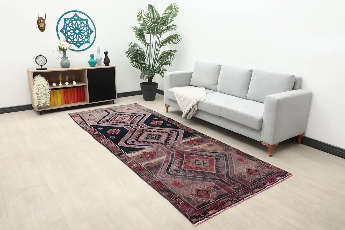 Wide view of the charcoal and red runner rug in a room with decor