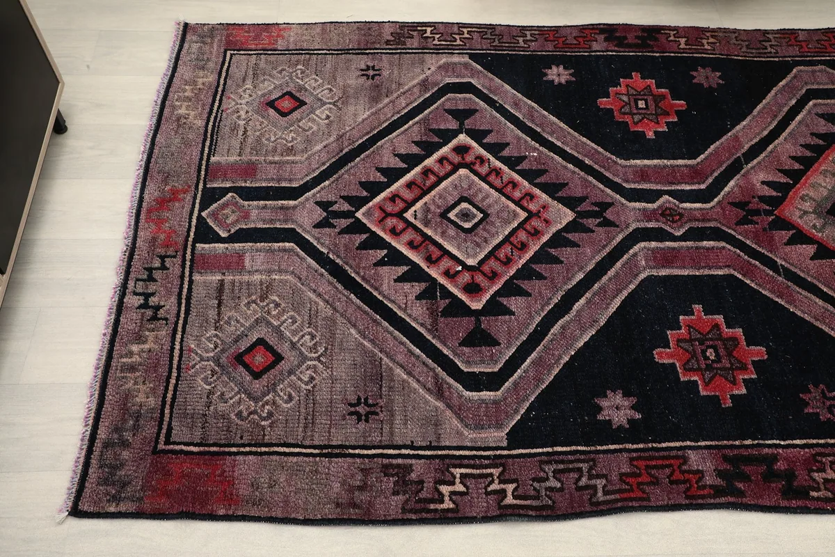 Detailed view of the end of the runner rug with tribal patterns